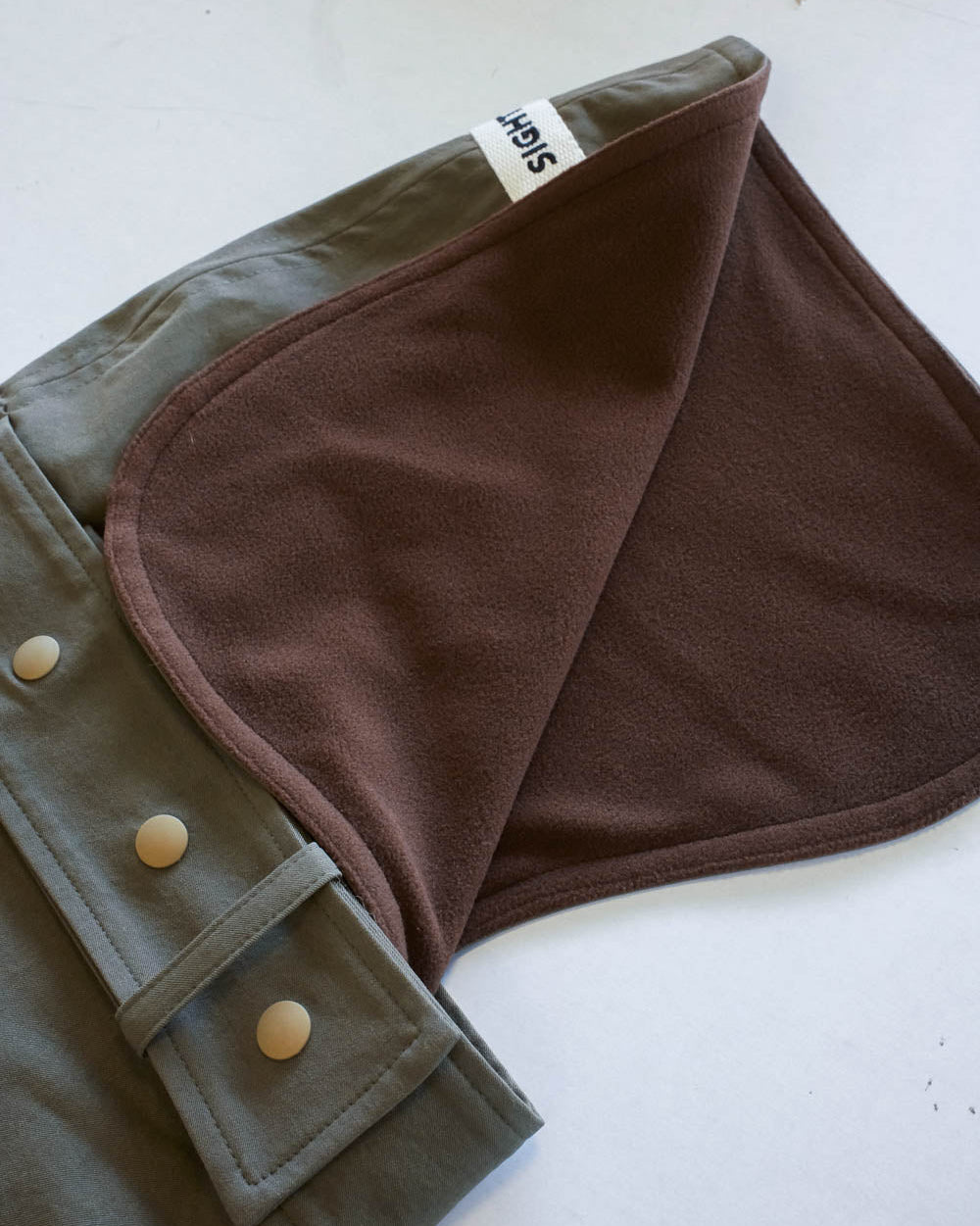 Brown Fleece Lining in Whippet Raincoat in Olive